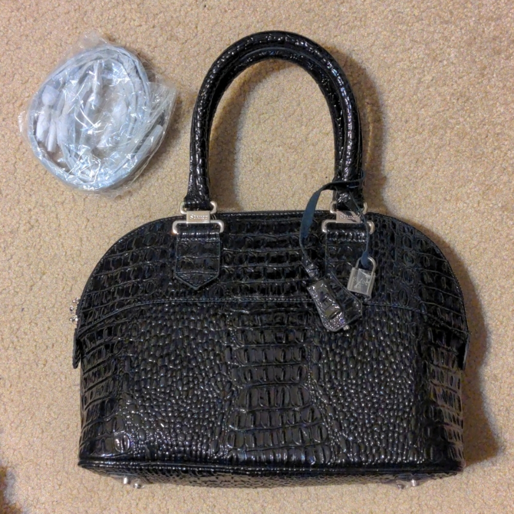 Black Stauer handbag and cover